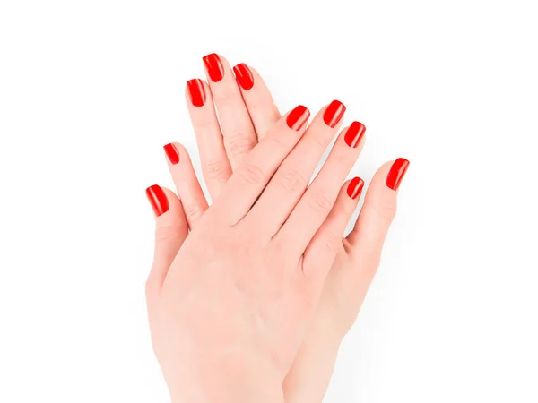 女人的手与明亮的红色指甲油 被隔离在白色的快捷方式上 — 图库照片