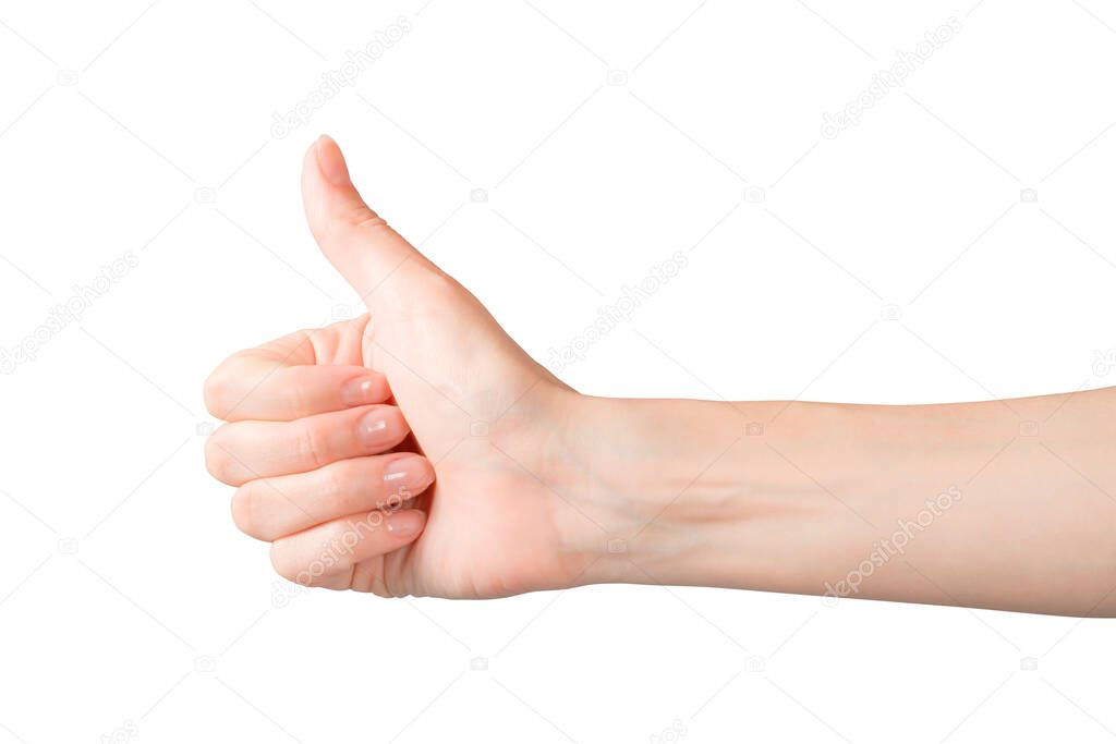 Woman hand showing thumb up gesture. Isolated on white, clipping path included