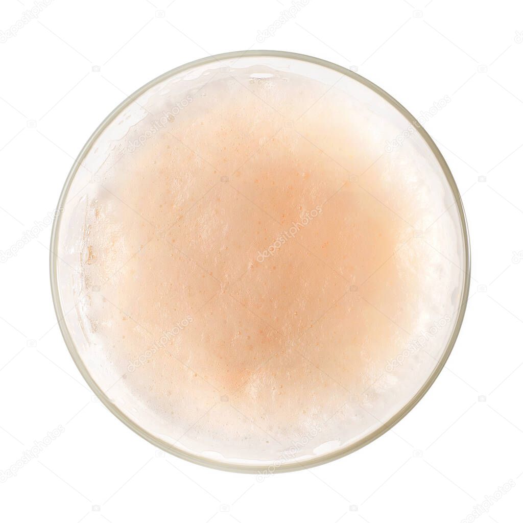 Beer foam into glass close up. Top view isolated on white