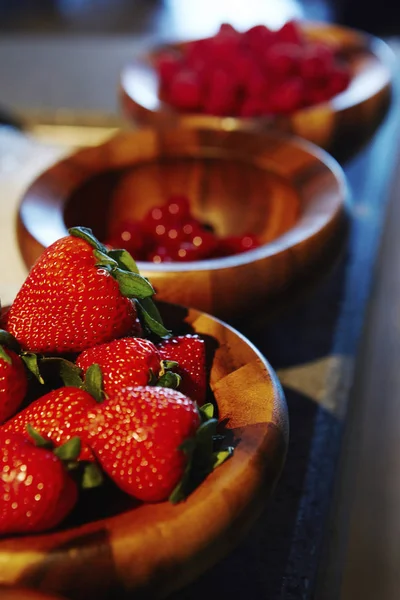 Close up of strawberries in wooden bowl, Dubai, United Arab Emirates