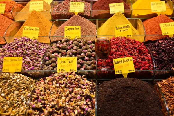 Tea and spices in containers on market stall
