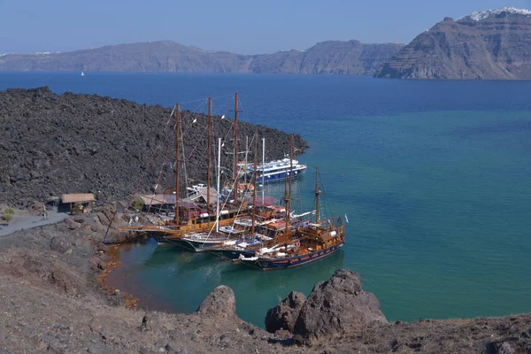 aerial view of old wooden ships near the island