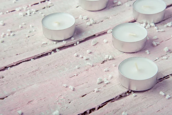 Few Flat White Candles Beautiful Wooden Pink Table — Stock Photo, Image