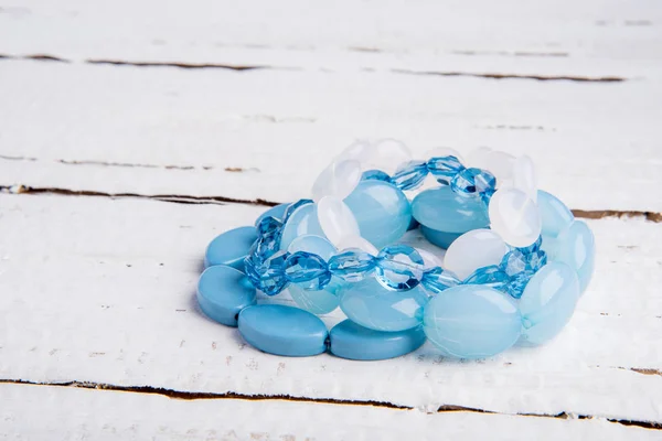 Several Beautiful Blue Bracelets Beads White Wooden Background — Stock Photo, Image