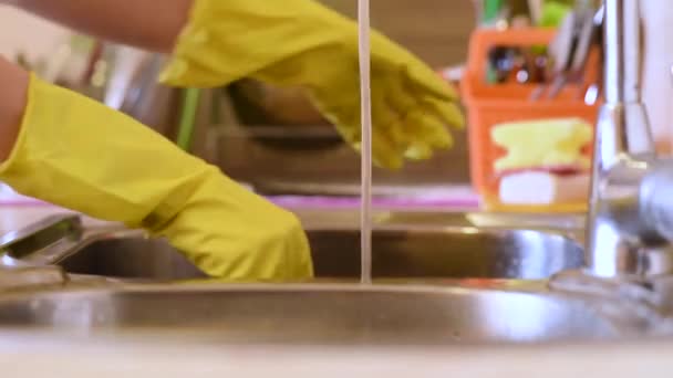 Woman Putting Rubber Gloves Washing Dishes Home — Stock Video