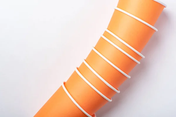 Orange eco-friendly paper cups for a party on a white background — Stock Photo, Image