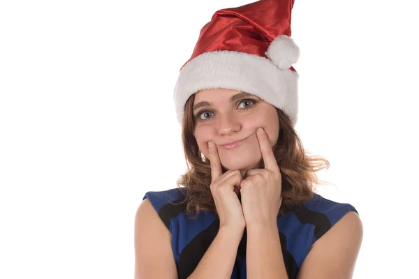 Menina em um chapéu de Natal vermelho com diferentes emoções engraçadas no rosto — Fotografia de Stock
