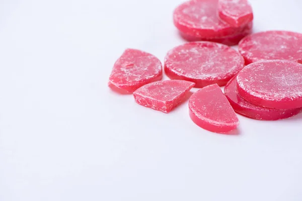 Red wax for depilation in tablets close up on a white background — Stock Photo, Image