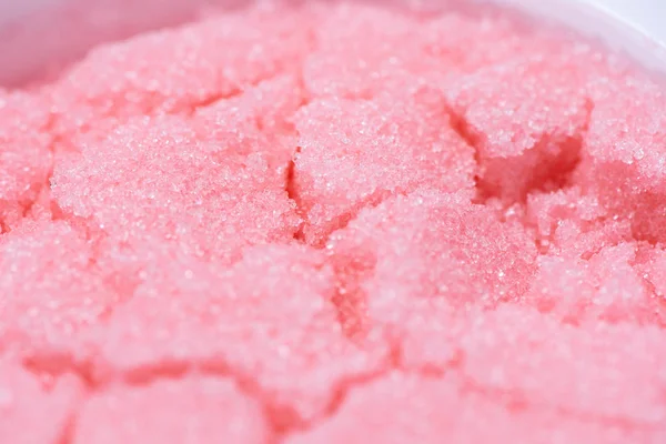 Pink sugar scrub with the smell of strawberries for the depilati