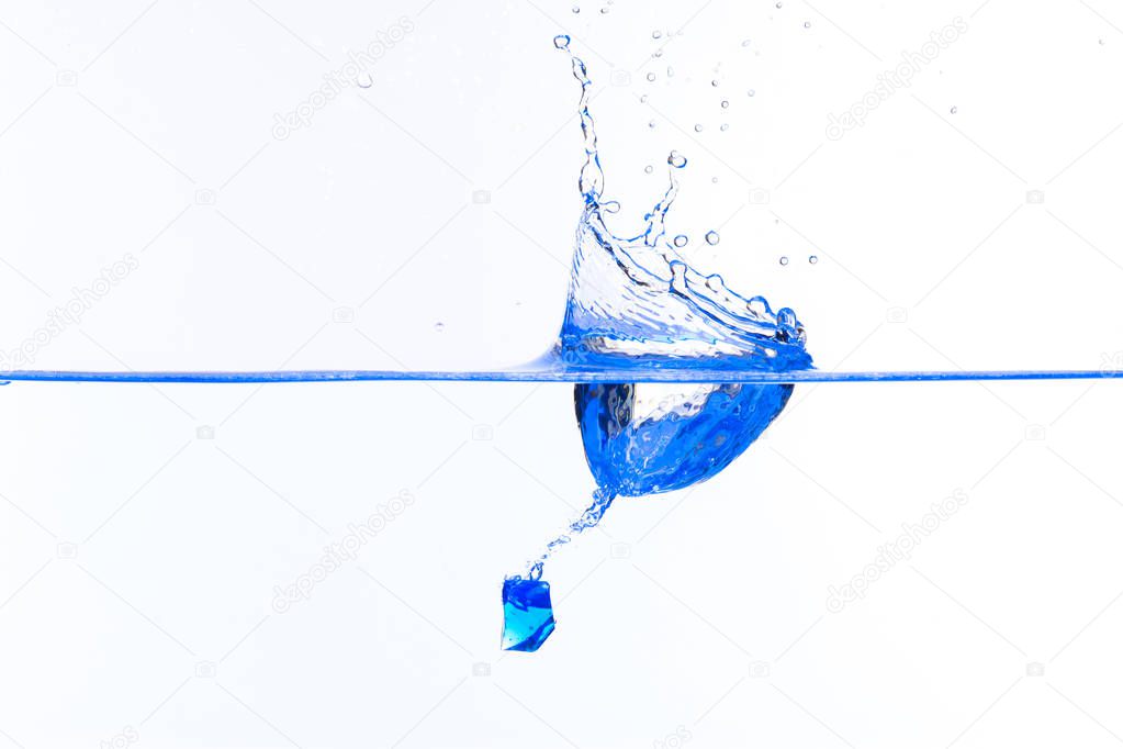 Beautiful and cool splashes of water from falling into it blue t