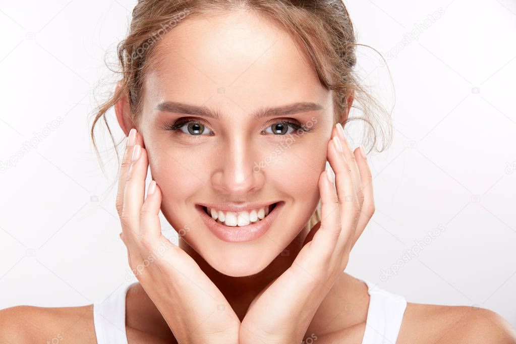 beautiful smiling woman with white teeth using dental floss, dentistry concept