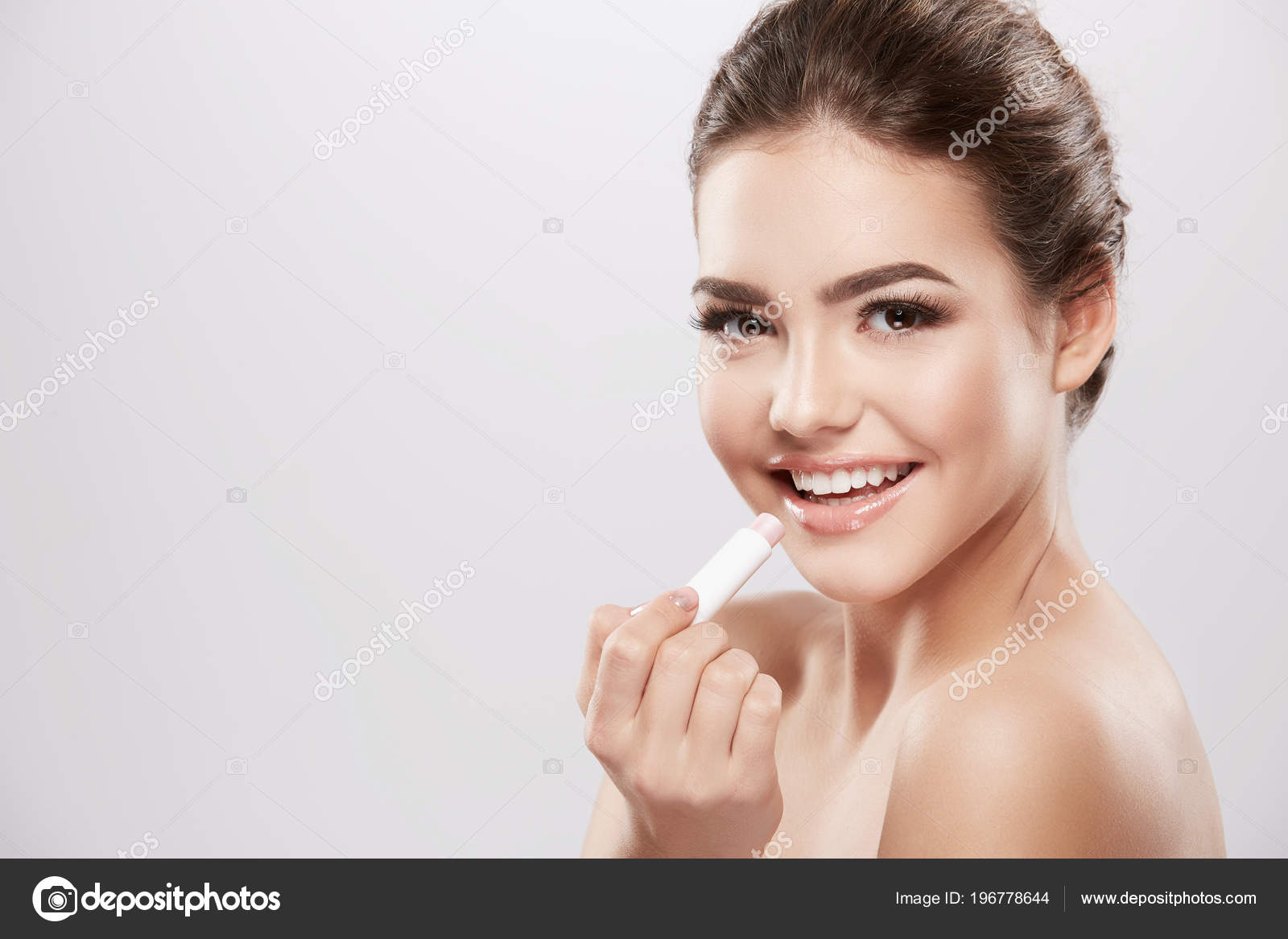 Beautiful Smiling Woman Naked Shoulders Using Lip Balm Skin Care Stock