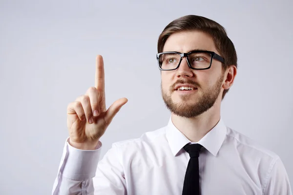 young handsome businessman showing attention sign