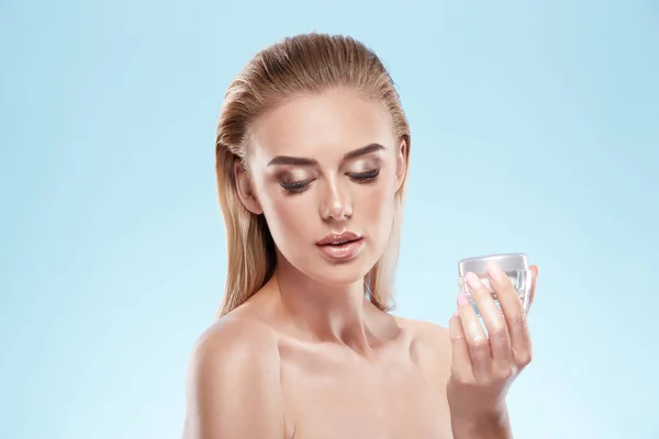 Model posing with face cream