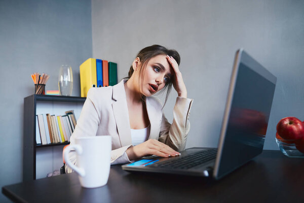 young businesswoman in suit in office