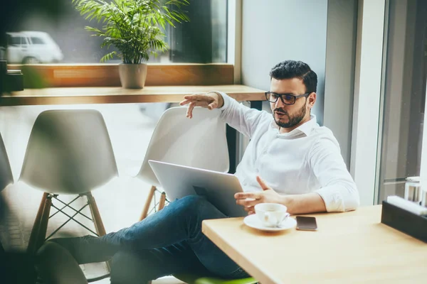young handsome businessman working alone in cafe