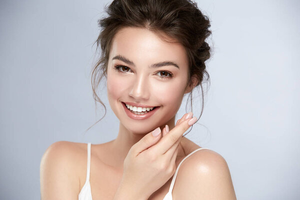 model with perfect smile and beautiful face isolated on grey