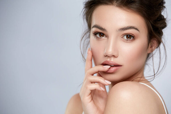 handsome woman portrait with highlighters and glossy lips