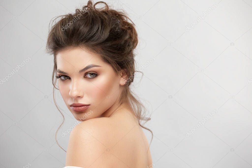 strong woman face with perfect mua and naked shoulders, copy space, beauty and cosmetic concept