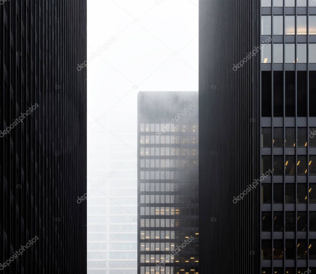 Front view of the Toronto financial district in city downtown with misty sky