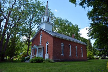 PIGEON HILL QUEBEC CANADA - 06 06 2020: Parish Chapel founded in 1859, church consecrated by Bishop Fulford on 7th June, 1860. The church has no electricity or central heating.