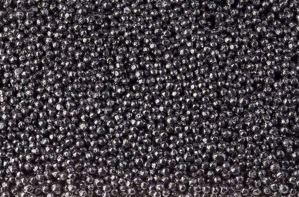 Black caviar close-up as a background.