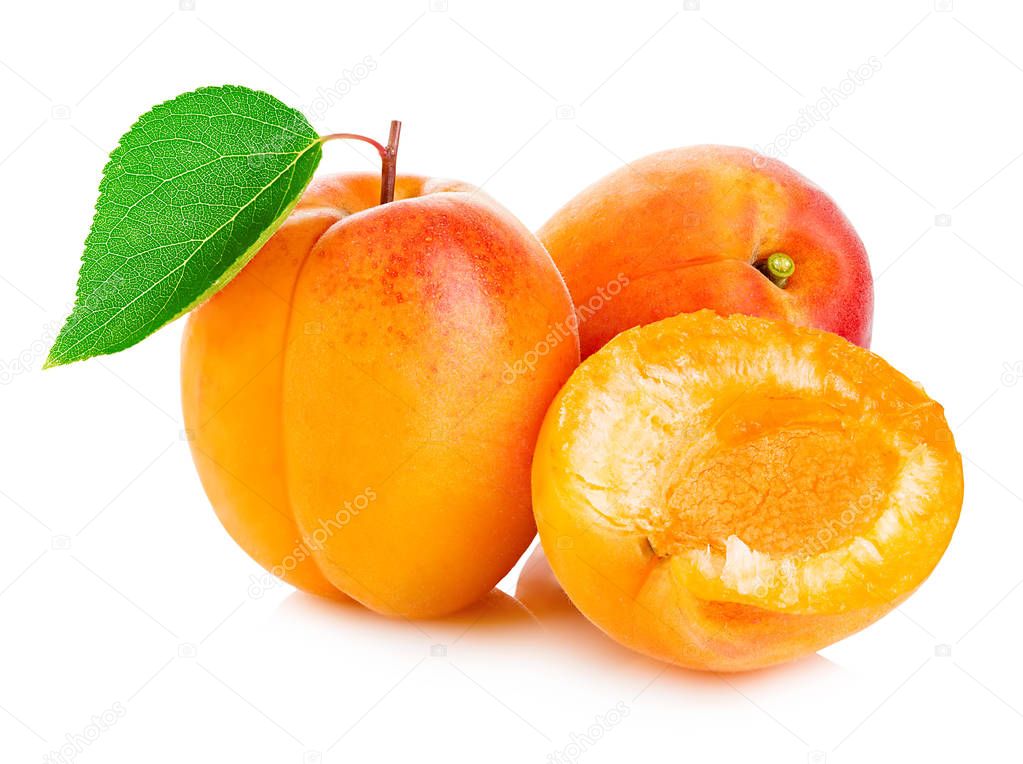 Fresh apricots with leaf close-up isolated on a white background.