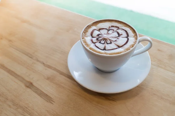hot coffee with foam milk art. Black cup of coffee. Hot coffee i
