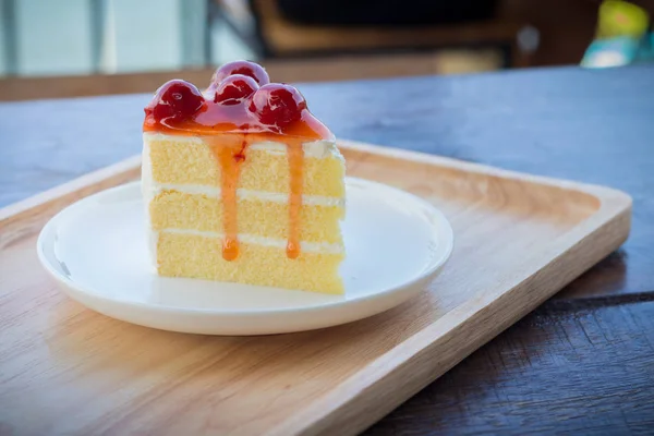 Sponge cake with cherry syrup. Peace of cherry cake served in af