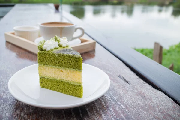 green tea cake with coffee breakfast set in outdoor restaurant