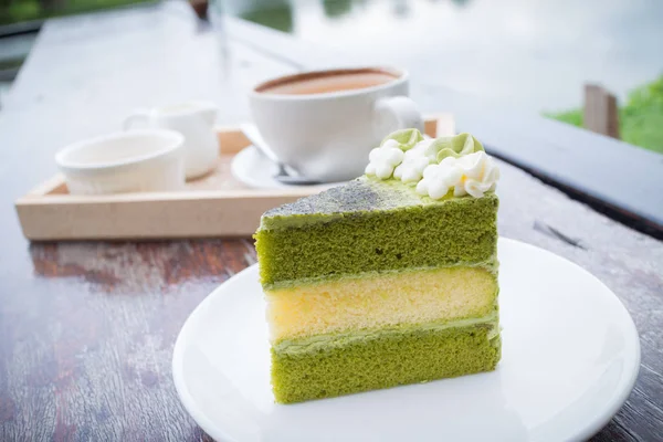 green tea cake with coffee breakfast set in outdoor restaurant