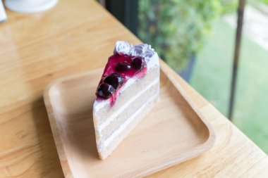 whipped cream cake with blueberry syrup topping