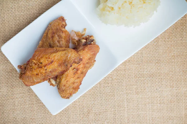 Fried chicken wings and crispy garlic with sticky rice(selective focus)