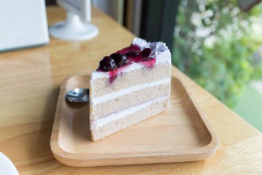 whipped cream cake with blueberry syrup topping