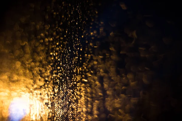Abstract blur background of gold lighting during raining — Stock Photo, Image