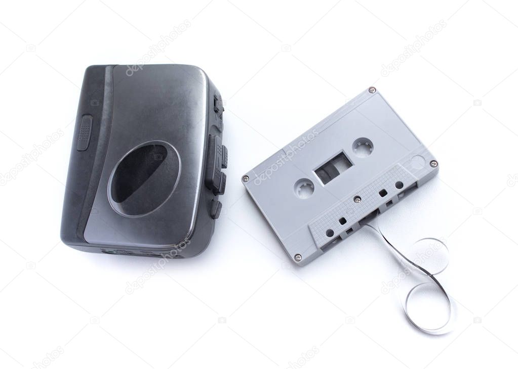 Old cassette player and cassette tape isolated on white backgrou