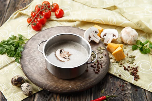 Mushroom soup in an iron saucepan — Stock Image Mushroom Soup Iron Saucepan Stock Photo