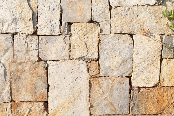 Stone wall made of various stones, structure — Stock Photo, Image