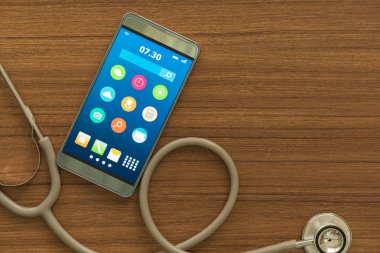 Virüsten koruma ve bakım, onarım hizmeti kavram smartphone. Görünümü telefon masada bir stetoskop ile akıllı..