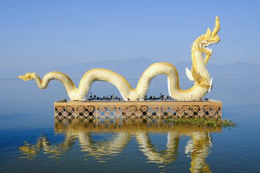 Dragon statue at the lake (Kwan phayao) in Phayao province. clipart