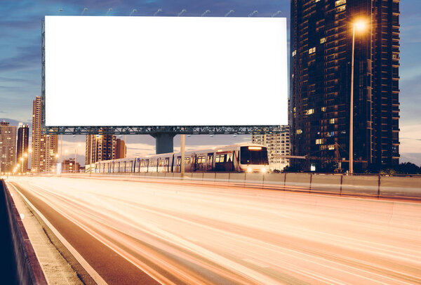 Blank template for outdoor advertising or blank billboard on the highway during the twilight. With clipping path on screen - can be used for trade shows, and advertising or promotional poster.