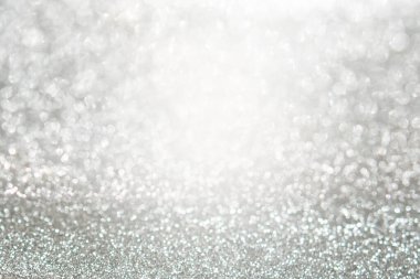 Gümüş parıltı, Bokeh soyutlamalı ve uzayı kopyalayan lüks bir arkaplan..