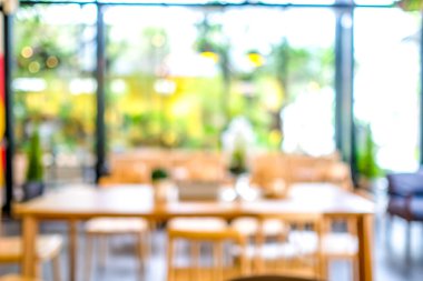 Kafede ya da kafeteryada bulanık, soyut Bokeh ışıklandırması arka planında..