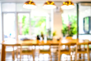 Kafede ya da kafeteryada bulanık, soyut Bokeh ışıklandırması arka planında..