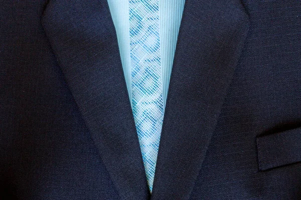 Close up of a few buttons on a business suit coat