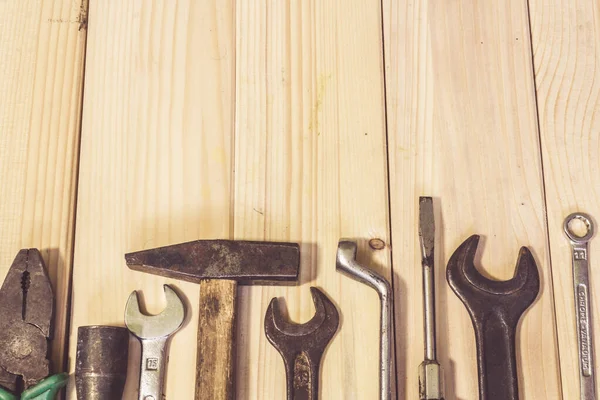 Assorted mixed work tools on wood