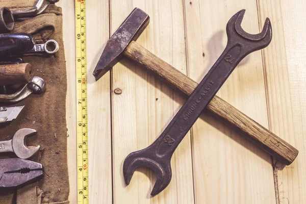 Assorted mixed work tools on wood