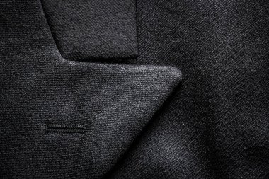 Takım elbise dokusuna yakın çekim. Macro bir iş ceketine ateş etti.