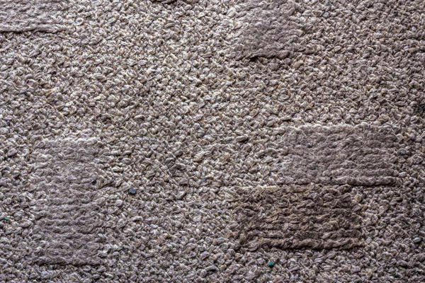 Black and white image of a fluffy carpet made from cotton