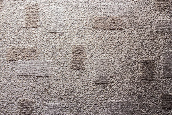 Black and white image of a fluffy carpet made from cotton